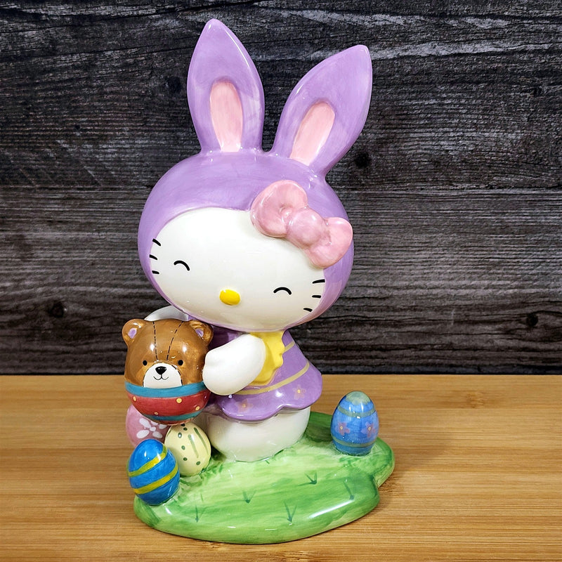 Load image into Gallery viewer, Hello Kitty Easter Bunny Ears Figurine Holding Bear Blue Sky Ceramic
