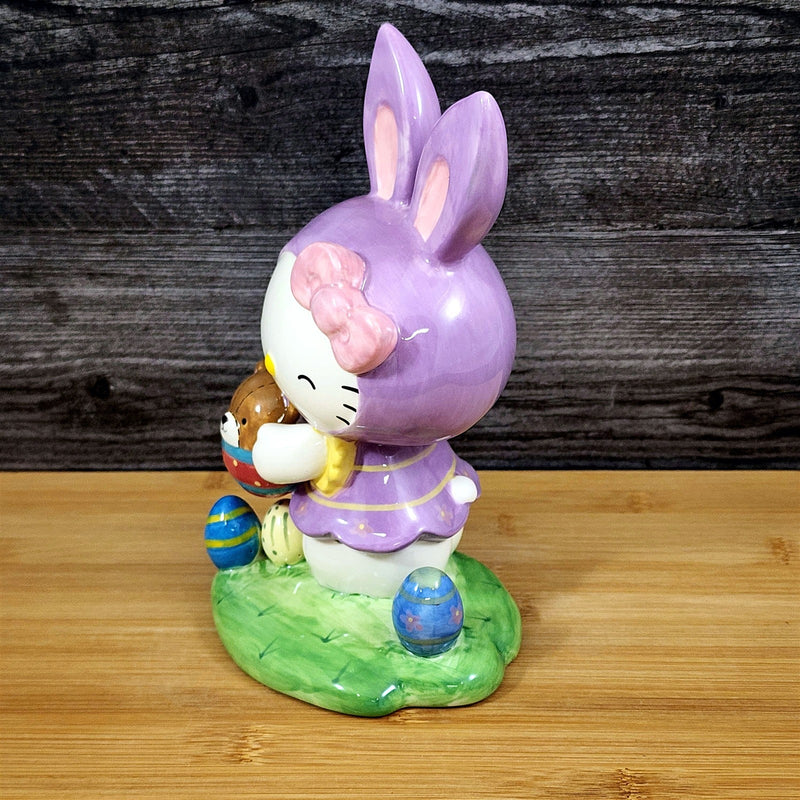 Load image into Gallery viewer, Hello Kitty Easter Bunny Ears Figurine Holding Bear Blue Sky Ceramic
