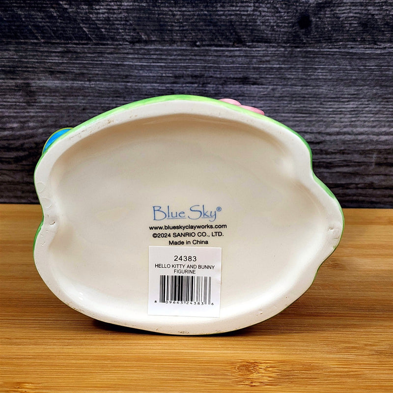 Load image into Gallery viewer, Hello Kitty Easter Bunny Ears Figurine Holding Bear Blue Sky Ceramic
