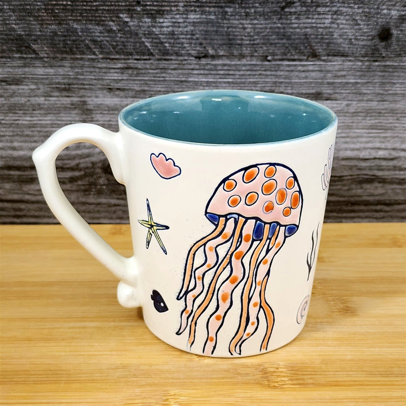 Load image into Gallery viewer, Whimsical Jelly Fish Coffee Mug Sea Creatures Ceramic Embossed Tea Cup Blue Sky
