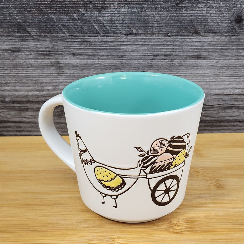 Load image into Gallery viewer, Easter Basket Coffee Mug Bunny &amp; Cart Ceramic Tea Cup Aqua Inside Blue Sky 14oz
