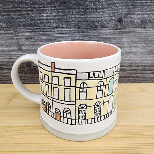 Whimsical Cityscape Coffee Mug Pastel Design Pink Interior Pottery Cup Blue Sky