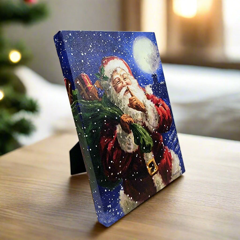 Load image into Gallery viewer, LED Lit Tabletop Picture Art of Santa Claus Winter Scene Kris Kringle with Pack
