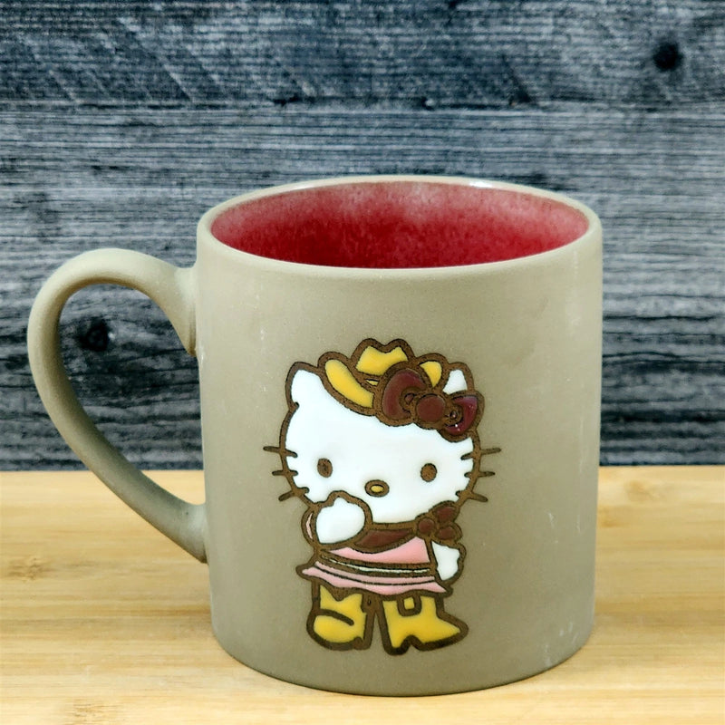 Load image into Gallery viewer, Hello Kitty Coffee Mug Cowgirl Brown Embossed Ceramic Tea Cup Blue Sky 18oz
