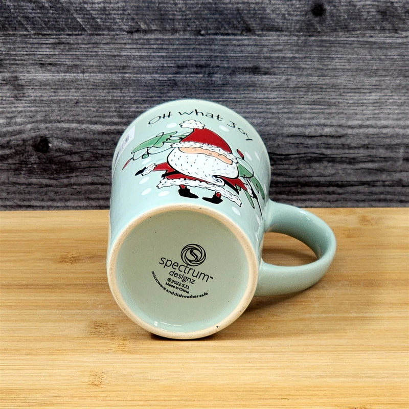 Load image into Gallery viewer, Coffee Mug Christmas Holiday Santa Green Embossed Tea Cup Ceramic Blue Sky 17oz
