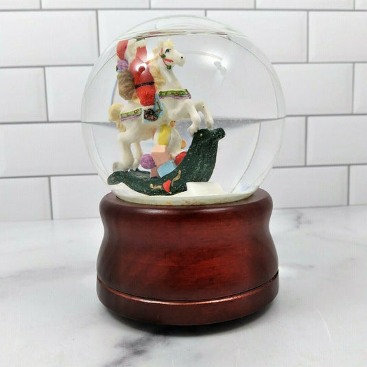 Santa on Rocking Horse Animated Music Box Snow Globe